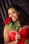 Beautiful, Biracial High School Senior wearing red prom dress