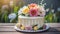 Beautiful birthday or wedding cake decorated with spring flowers. Delicious festive dessert