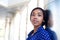 Beautiful black business woman in blue shirt