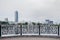 Beautiful black cast fence of the city embankment overlooking the center of Yekaterinburg.