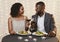 Beautiful black couple having romantic dinner in restaurant