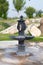 Beautiful black drinking column fountain with taps on street in tourist ancient city of Hierapolis, Pamukkale, Turkey