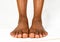 Beautiful Black female Flat feet with smooth skin. African American woman healthy foot baby. Feet of baby`s naked isolated on whit