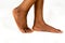 Beautiful Black female Flat feet with smooth skin. African American woman healthy foot baby. Feet of baby`s naked isolated on whit