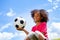 Beautiful black girl portrait with football ball