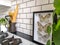 Beautiful black and white framed butterflies in a black and white subway tiled kitchen
