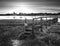 Beautiful black and white low tide landscape of Bosham Harbour w