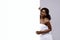 Beautiful Black Woman Wrapped In Towel After Bath Holding White Advertisement Board