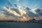 Beautiful blazing sunrises landscape with cloud and sun rays at Ao Prachuap bay with Saranwithi bridge stretching in to the sea