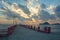 Beautiful blazing sunrises landscape with cloud and sun rays at Ao Prachuap bay with Saranwithi bridge stretching in to the sea