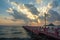 Beautiful blazing sunrises landscape with cloud and sun rays at Ao Prachuap bay with Saranwithi bridge stretching in to the sea