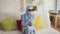 Beautiful blind Muslim girl in hijab at home,enjoys smartphone