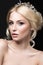 Beautiful blond girl in the image of a bride with a tiara in her hair. Beauty face. Wedding image.