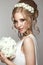 Beautiful blond girl in image of the bride with white flowers on her head. Beauty face.