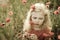 Beautiful blond girl and red poppy flowers