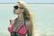 Beautiful blond girl in sunglasses on beach.beauty woman.vacation