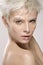 Beautiful blond model wearing elegant artistic makeup