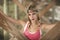 A beautiful blond woman with braids under pier in St.Augustine, Florida.