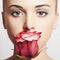 Beautiful blond woman with flower.girl and rose