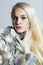 Beautiful blond woman in fur.winter fashion.Beauty blond Model Girl in Rabbit Fur