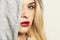 Beautiful blond woman in hood. red lips