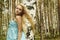 Beautiful blond woman in russian forest. flying hair