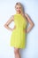 Beautiful blond woman wearing lemon dress