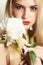 Beautiful blond woman with white flower