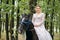 Beautiful blonde bride riding a horse rides a wedding ceremony, wedding day