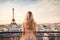 Beautiful blonde girl with Eiffel tower in Paris, France, Once in Paris. Back slim chic woman with long blond hair in dress on