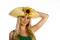 Beautiful blonde girl with hat and sunflower