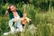 Beautiful blonde girl in nature picnic basket in the rays of the soft sunset