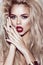 Beautiful blonde girl with sensual lips, fashion hair, black art nails. Beauty face.