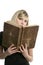 Beautiful blonde student girl with old book