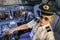 Beautiful blonde woman pilot wearing uniform at flight simulator