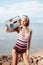 beautiful blonde woman in vintage swimsuit posing