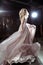 Beautiful blonde young bride woman in color wedding dress. rock style