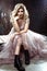 Beautiful blonde young bride woman in color wedding dress. rock style
