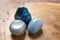 Beautiful blue angelite, grey agate and shattuckite gemstones on wooden stand