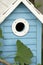 Beautiful blue birdhouse in the garden