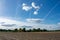 Beautiful blue cloud sky with contrails.