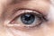 Beautiful blue eye of a young woman. Vision and health. Close-up