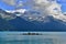 Beautiful blue Garibaldi Lake surrounded by high mountains with glaciers.