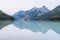 Beautiful blue Kucherla lake. Reflection of mountains in the water. Summer vacation in the mountains. Arrow image formed by