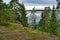 Beautiful blue lake and pine forest, Park Mon Repos, Vyborg, Russia