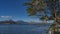 The beautiful blue lake is surrounded by picturesque mountains.