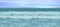 beautiful blue ocean, sea waves with foam fabulous sea tide, blue sky with clouds, concept transcendence, water sports, lack