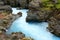The beautiful blue river and rock formations at Barnafoss waterfalls in Western Iceland
