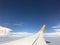 Beautiful of Blue sky above the clouds with wings of the airplane. View of Looking through the window of airplane