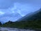 Beautiful blue sky. Aerial view stormy mountain river evening landscape